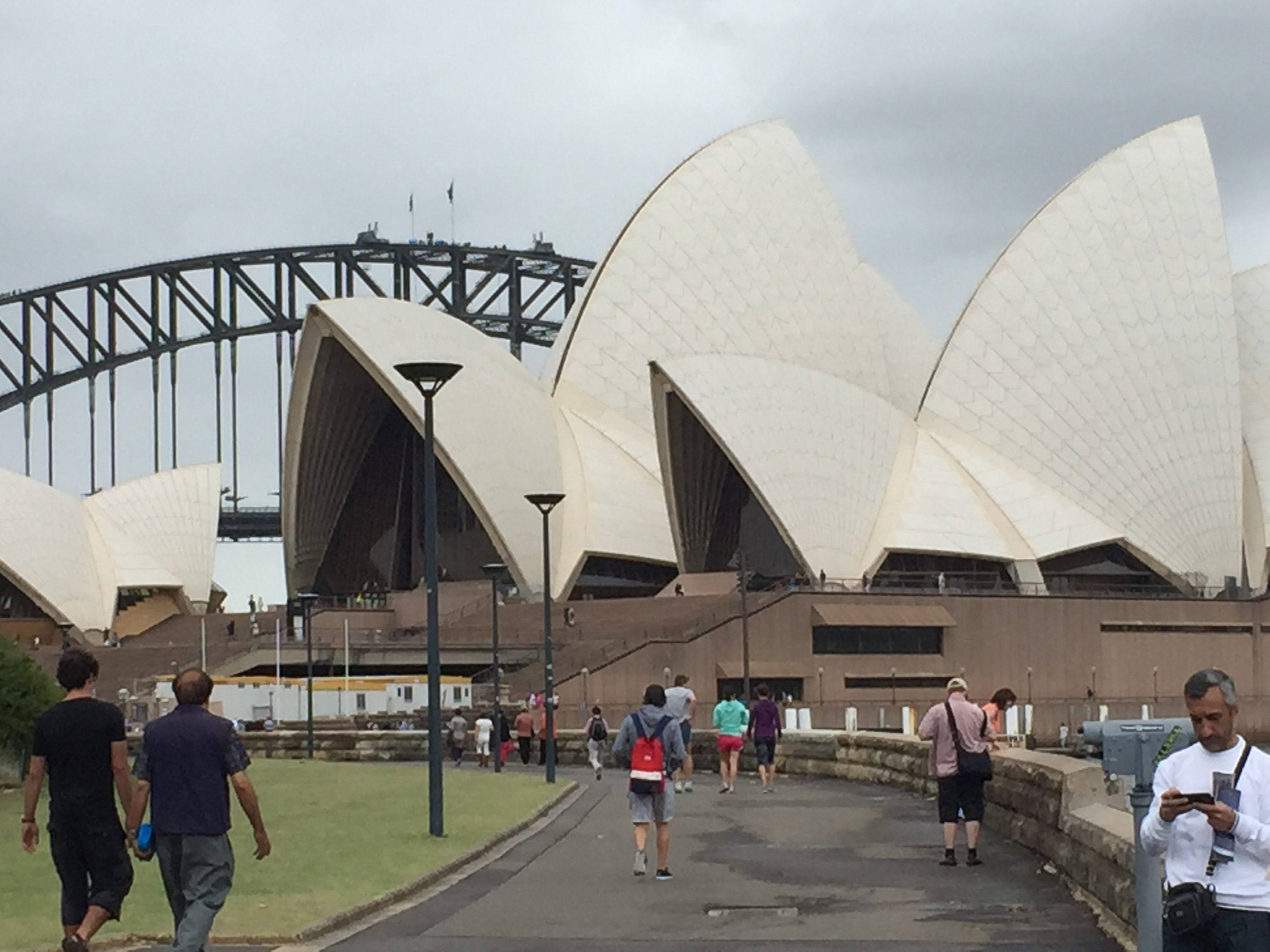 Sydney Opera House with the Harbour Bridge  in background.