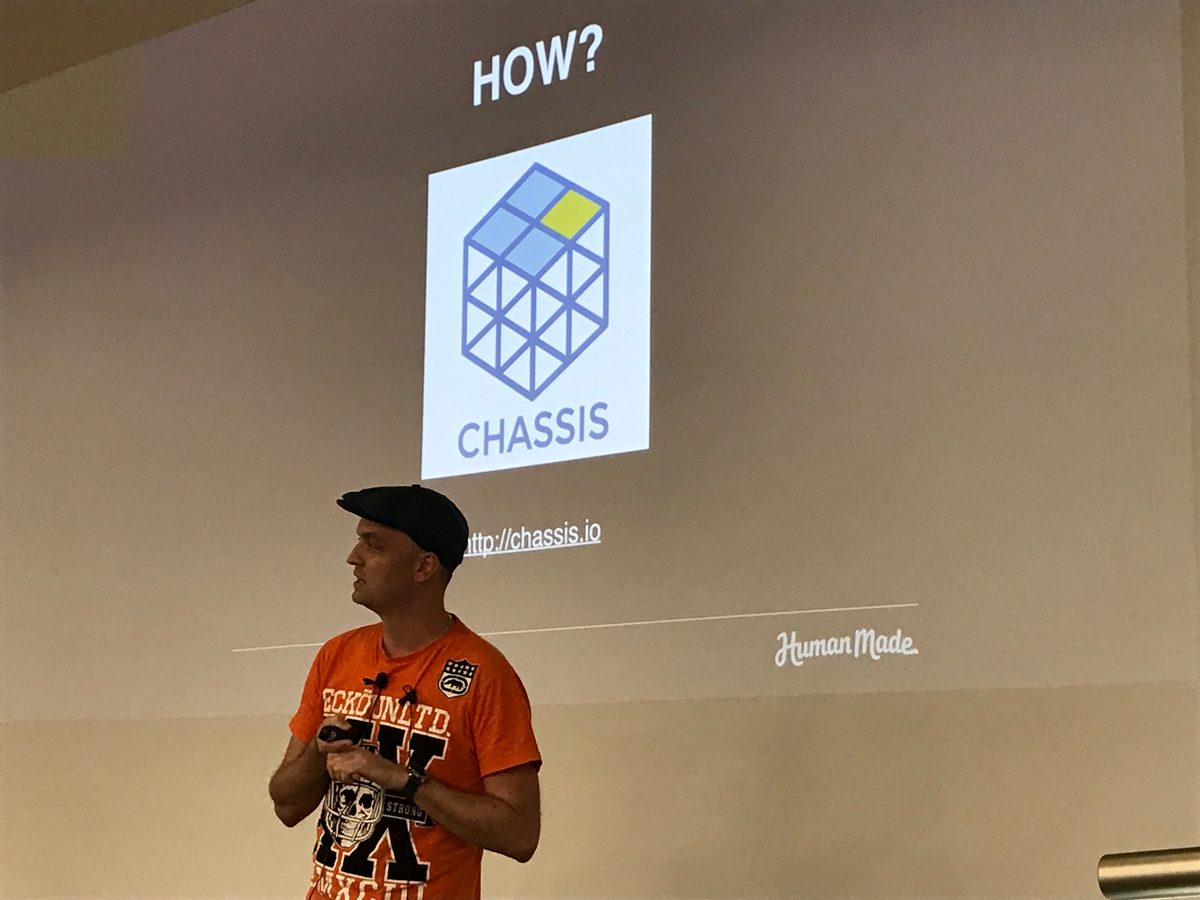 Bronson Quick presenting in front of a slide showing the Chassis logo