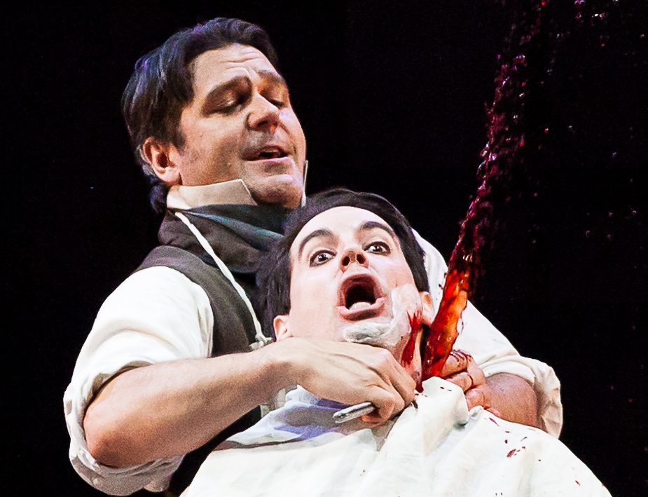 Photo from Sweeny Todd production of a man getting his throat cut