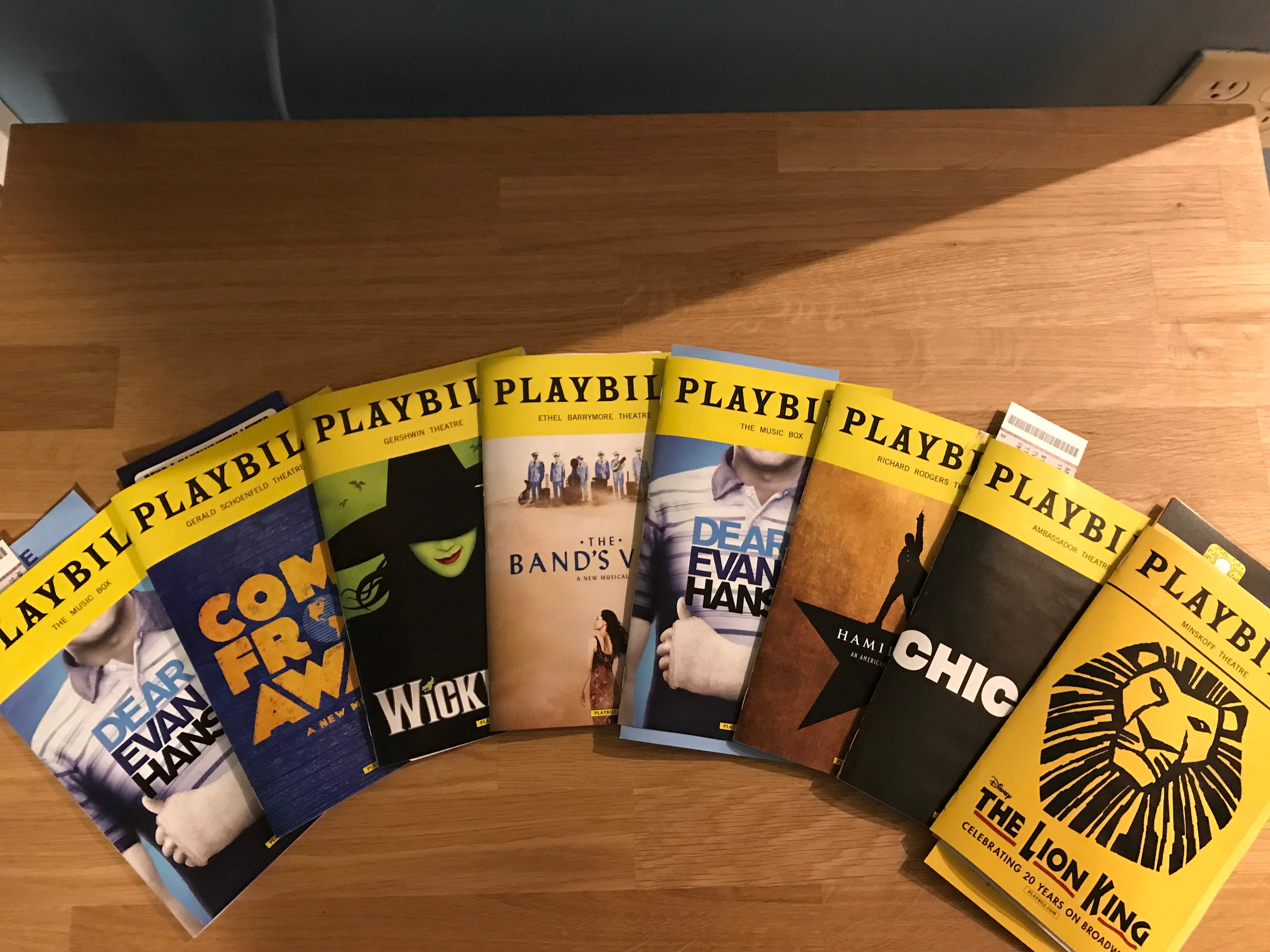A collection of playbills for Dear Evan Hansen, Come From Away, Wicked, Hamilton, The Lion King and Chicago