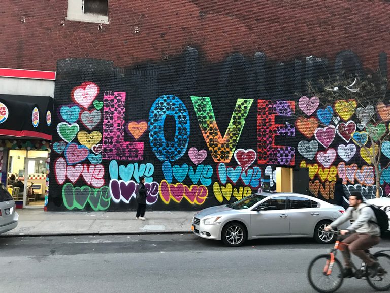 Street art featuring the word love repeated in various forms