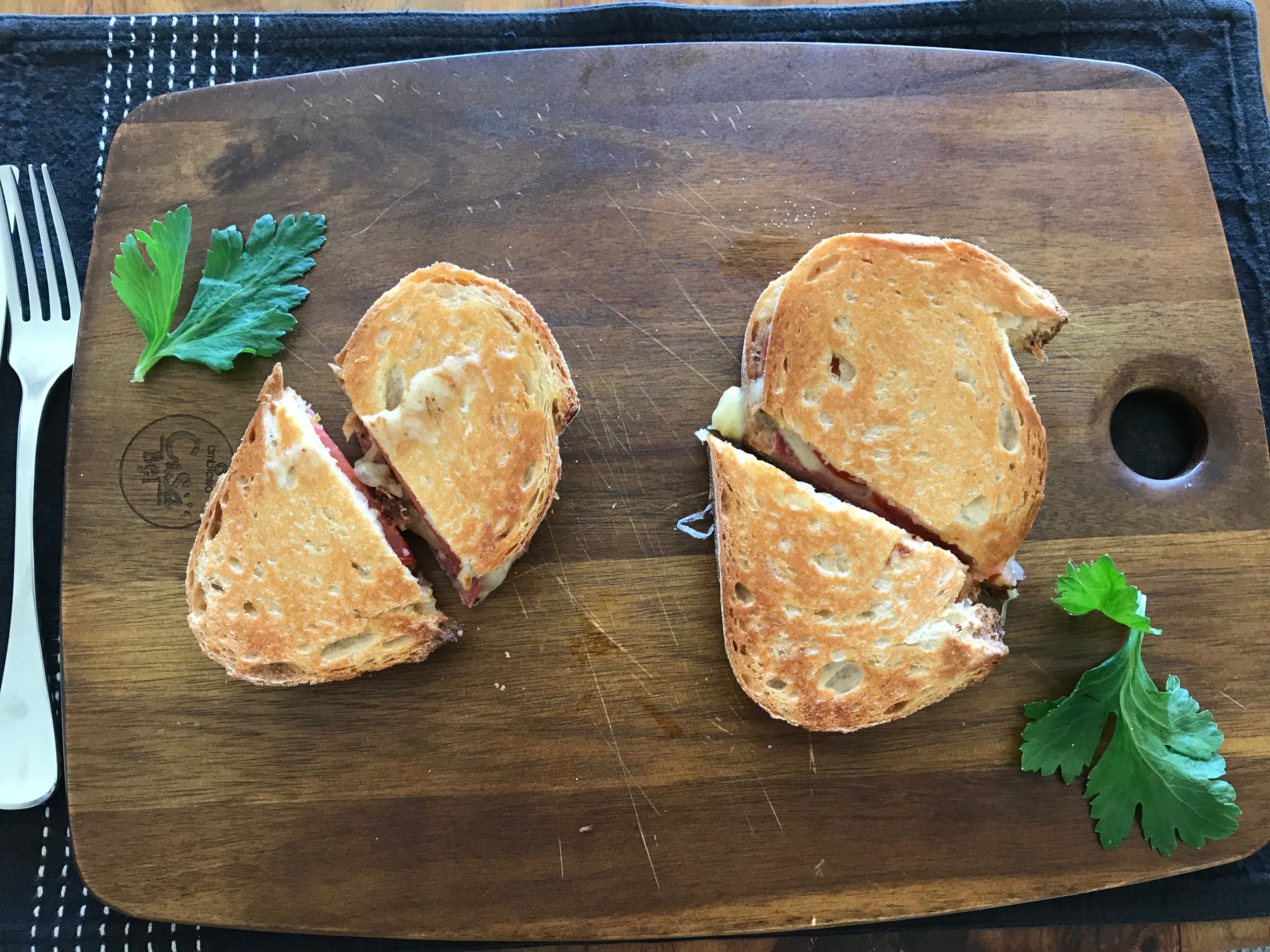 A toasted sandwich served on a chopping board