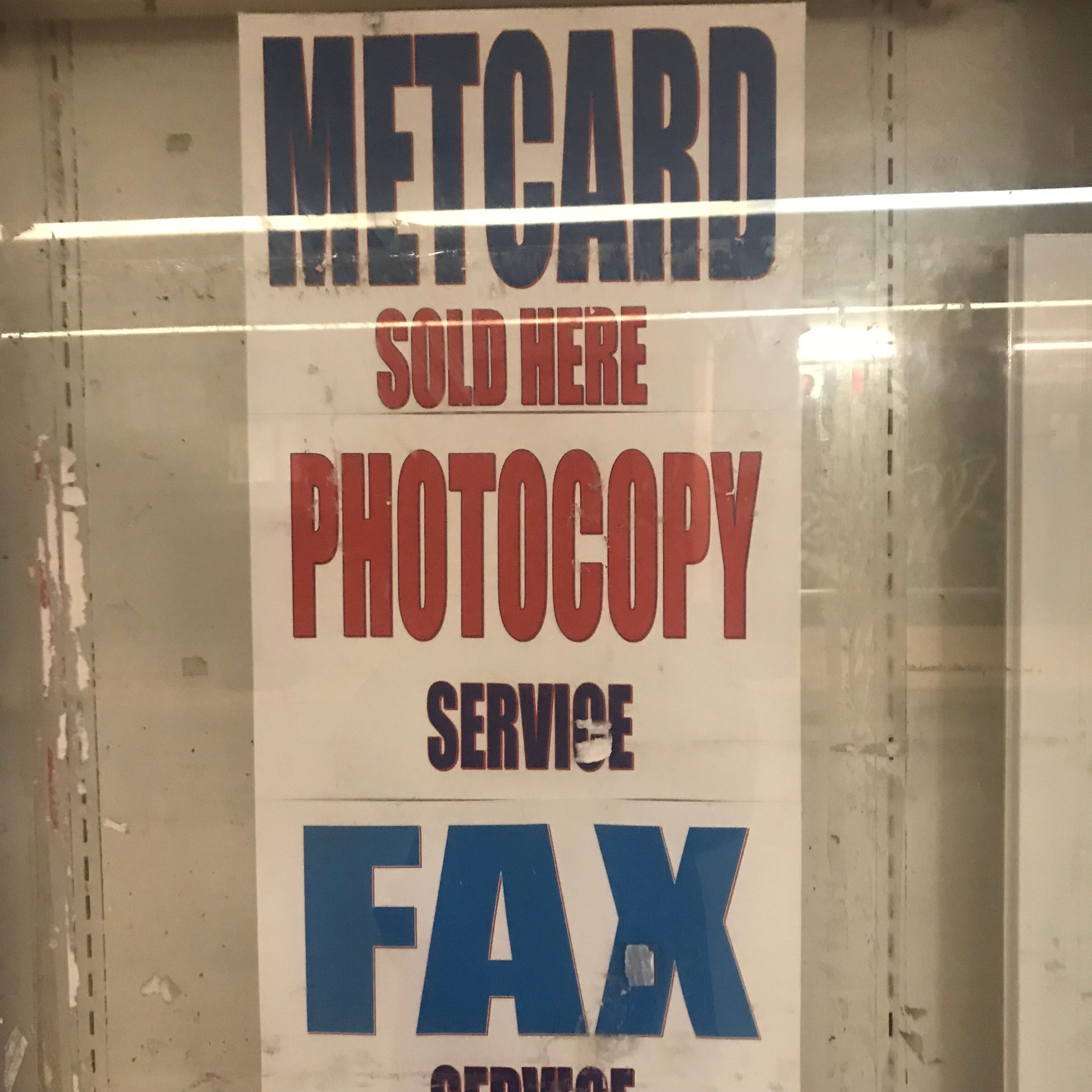 A shop sign saying "Metcard sold here, Photocopy services, Fax services"
