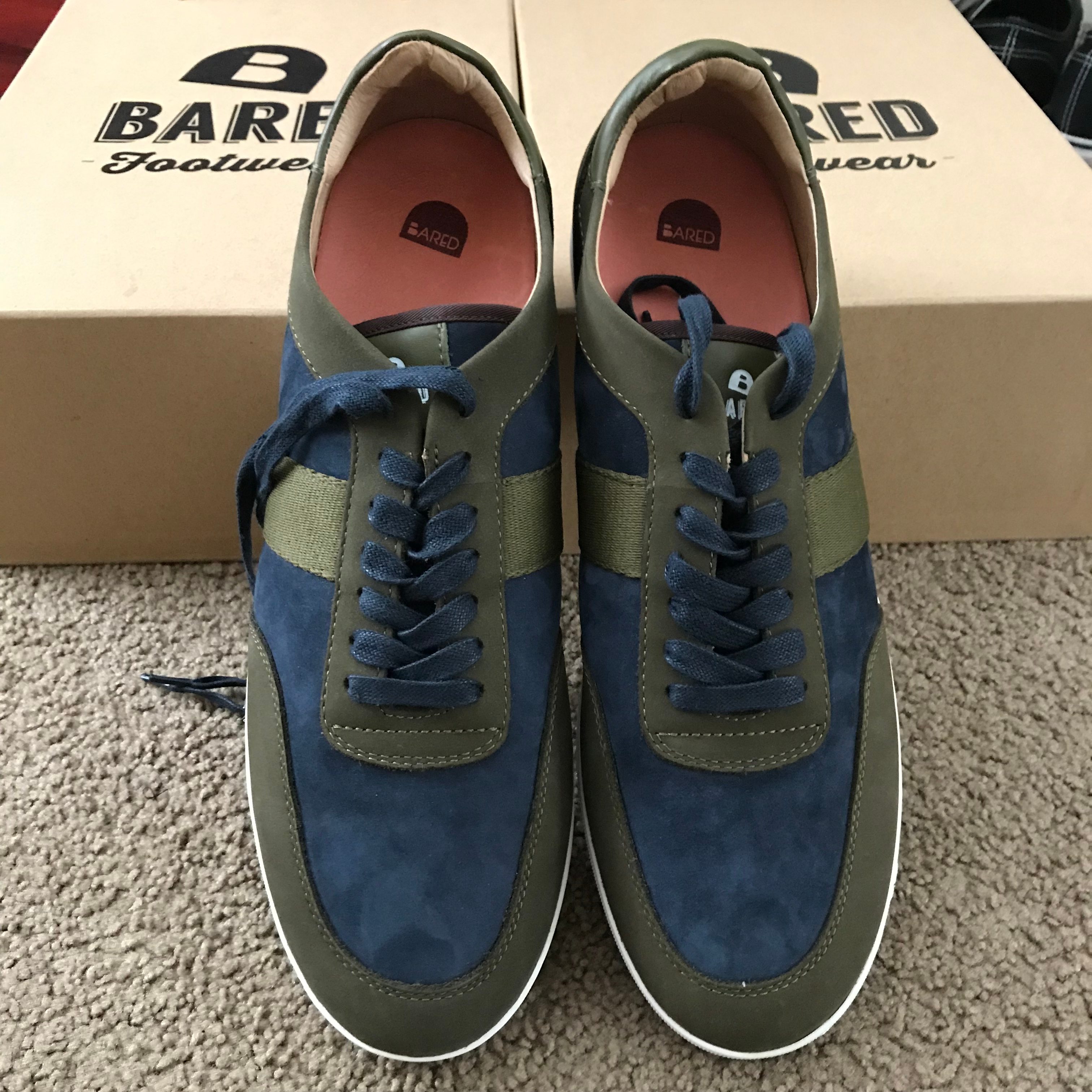 A pair of street shoes leaning against a shoe box