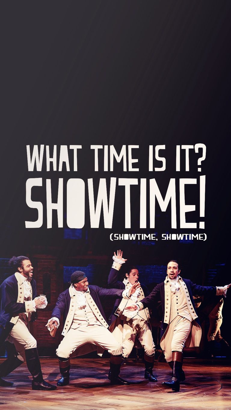 Hamilton, Lafayette, Laurens and Mulligan on stage in Hamilton under the text "What time is it? Showtime!"