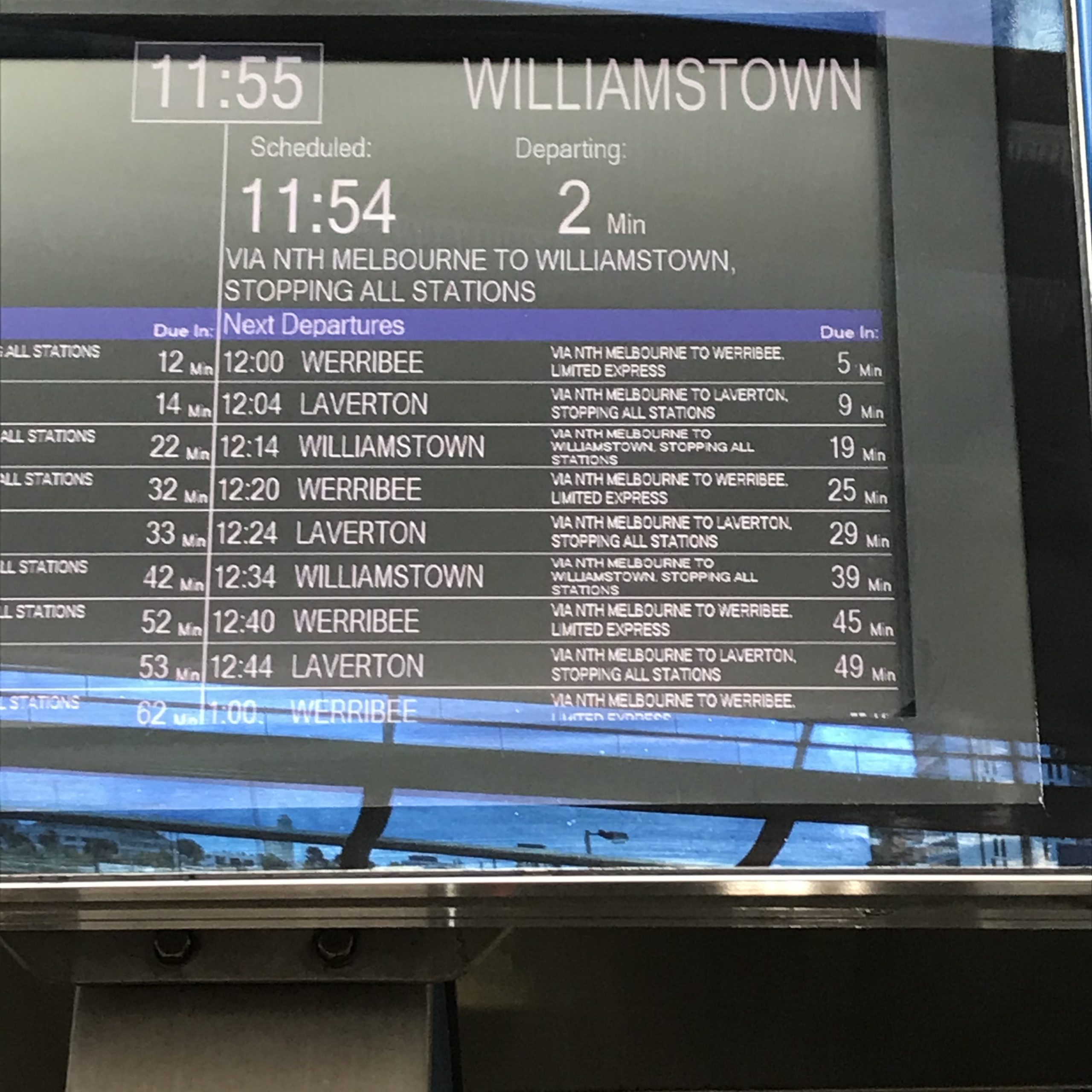 Railway sign showing departure time of Williamstown train.