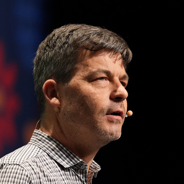 Peter speaking at a conference